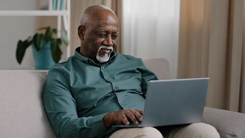 Man typing on laptop