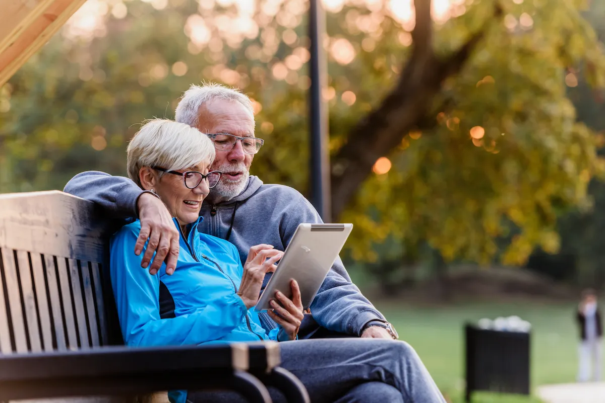 Elderly couple reading together