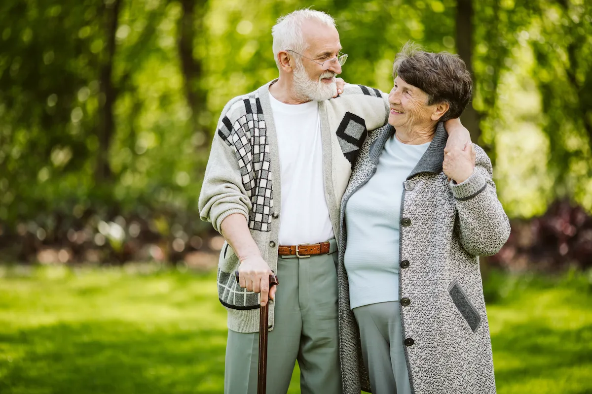 Elderly couple walking in the park