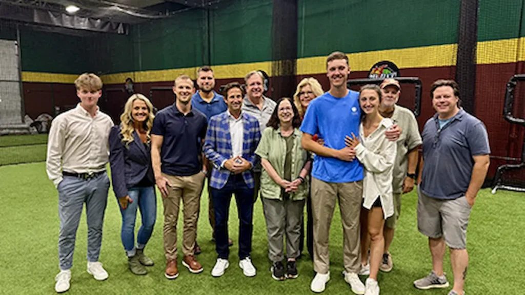 Jacob Misiorowski with a group of people at baseball training center