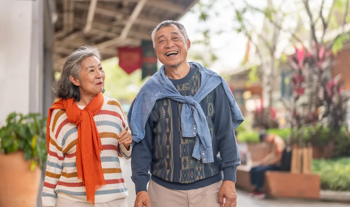 Man and woman walking and smiling
